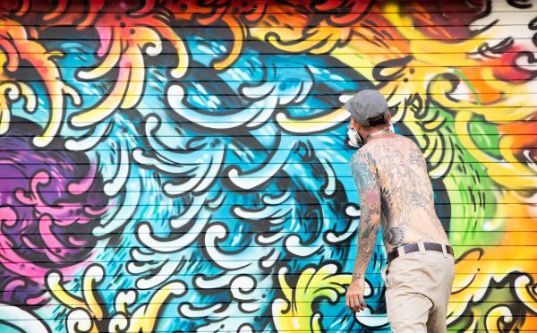 Pow Wow Hawaii Graffiti Mural by Marko Livingston, tattoo artist in Honolulu