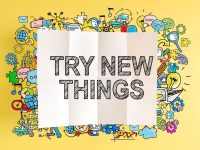 "Try New Things" sign