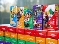 Girl Scout cookie boxes stacked on a table