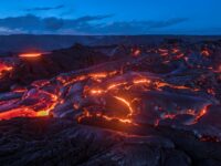 Dramatic night time lava flow from Kilauea volcano eruption 2017 photo